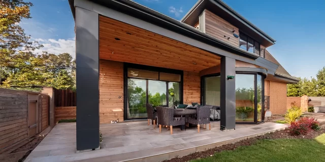 Firefly A beautifully expanded modern home with a newly added second story and a spacious sunroom, s